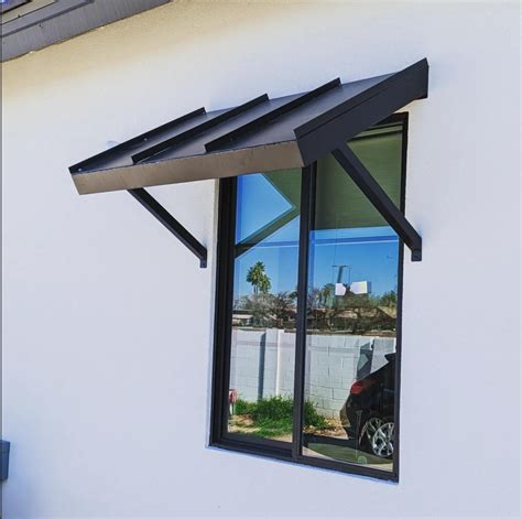 houses with modern metal window awneing s an shutters|modern window awnings.